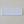 Load image into Gallery viewer, white cotton headband laying on a beige background
