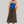 Charger l&#39;image dans la galerie, woman standing in front of grey backdrop wearing a cropped orange fuzzy sweater with a cobalt blue turtleneck.  Also wearing a brown maxi wool skirt and brown boots
