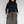 Charger l&#39;image dans la galerie, woman plus size standing wearing a black long-sleeve turtleneck and hand in pockets of brown maxi wool skirt
